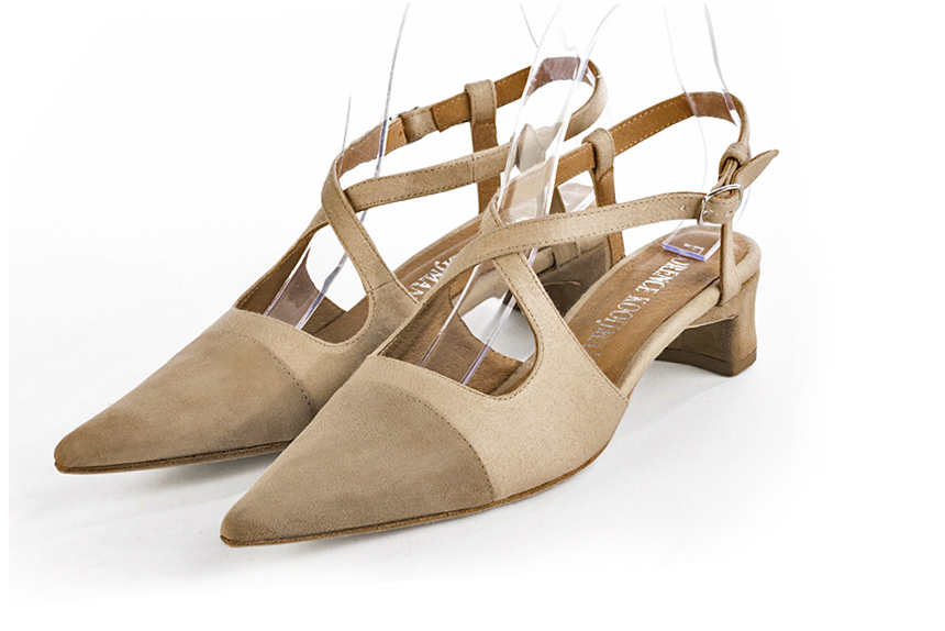 Tan beige women's open back shoes, with crossed straps. Pointed toe. Low kitten heels. Front view - Florence KOOIJMAN